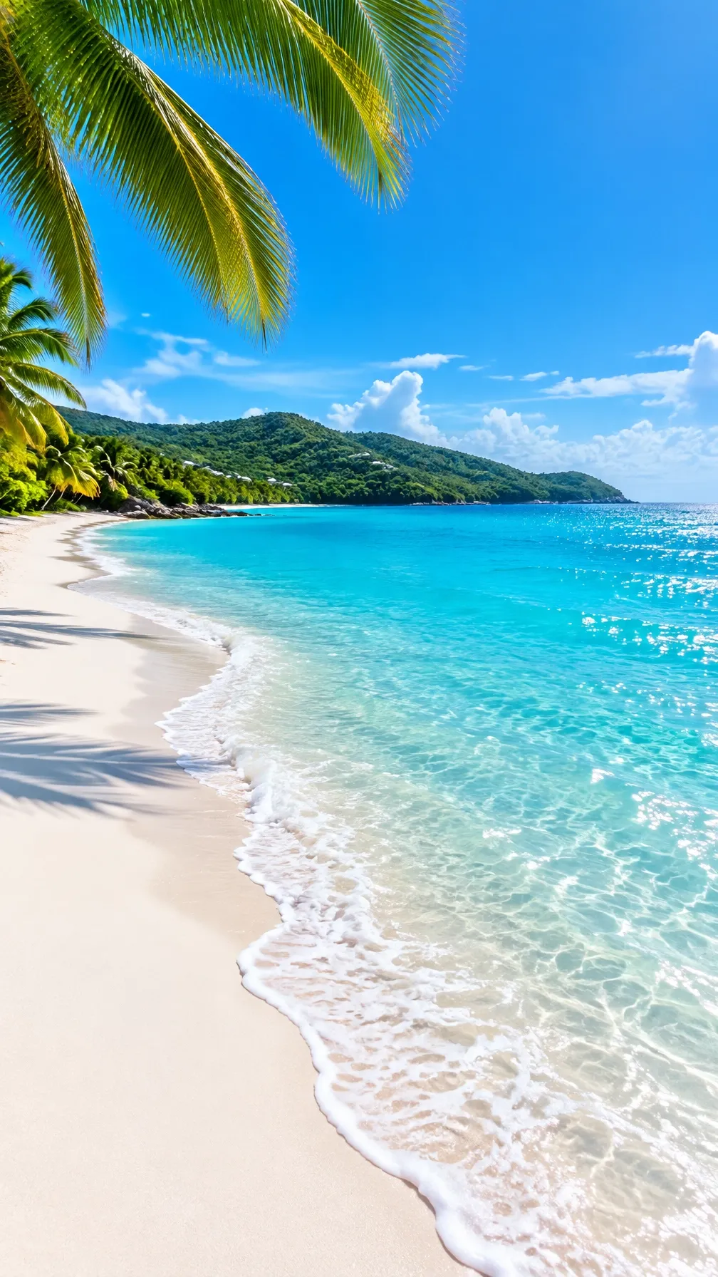 A bright tropical beach with clear turquoise water